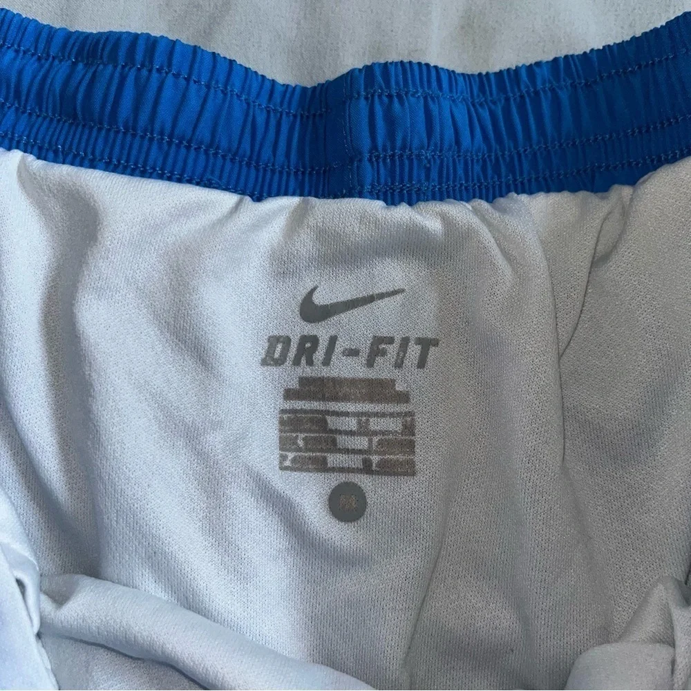 Nike Dri-Fit blue elastic waist lined shorts with green trim, adult size Medium